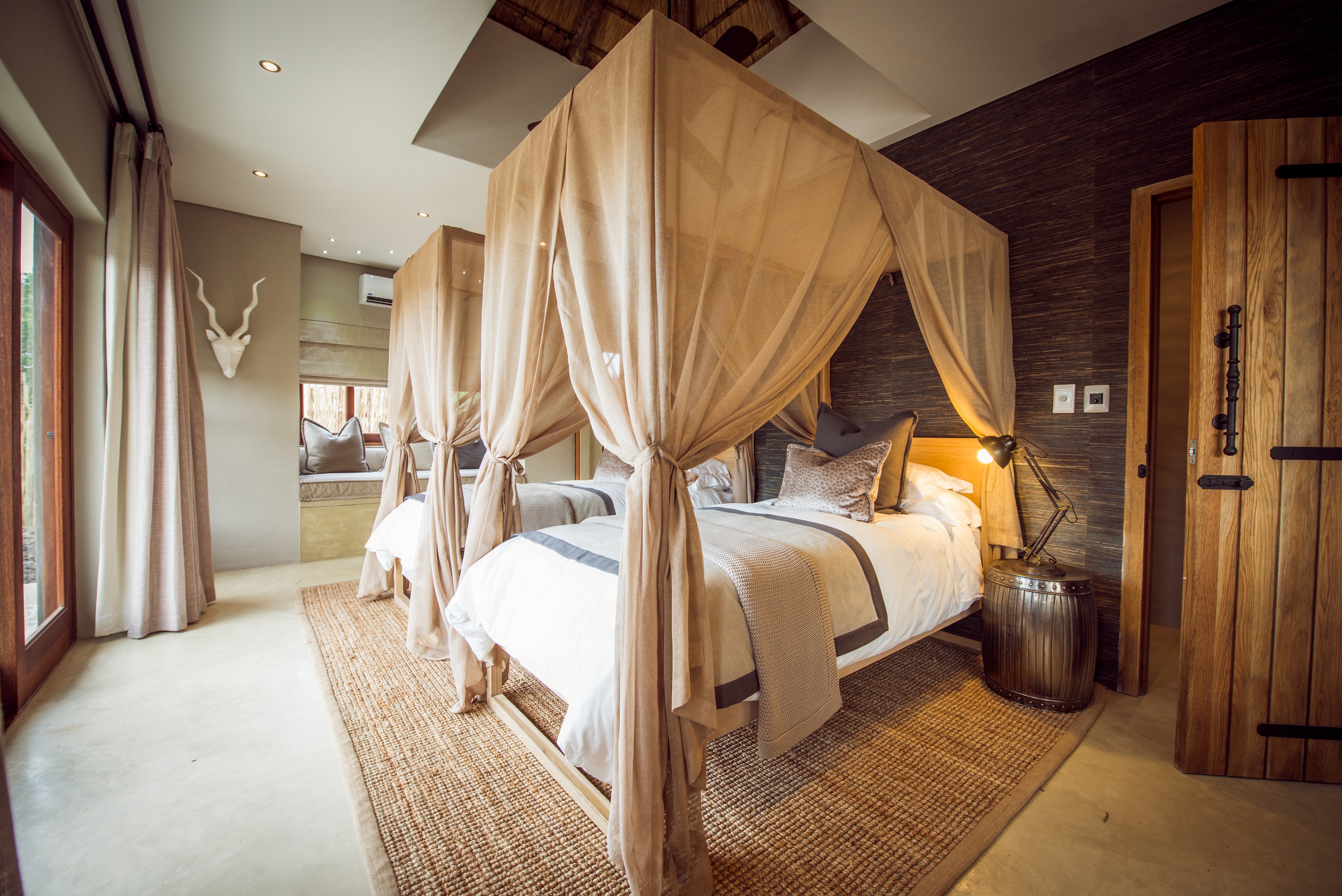 <p>The villas at Sabi Sabi Bush Lodge are designed with a focus on luxury and comfort while also incorporating elements of the surrounding natural environment. The villas feature thatched roofs, wooden decks, and large windows that offer panoramic views of the bushveld. The villas are spaced apart from each other, providing guests with a sense of privacy and seclusion.</p>